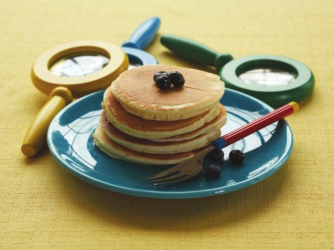 PANCAKES Oso pitches in to help his friend Olivia make pancake batter; encourage your kids to be just as helpful!