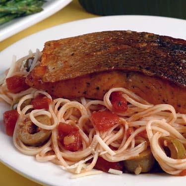 Picante Pasta with Salmon This quickly prepared dish has a refreshingly Mediterranean flavor. Green olives, garlic and hot pepper flakes give the pasta and fish a spicy kick.