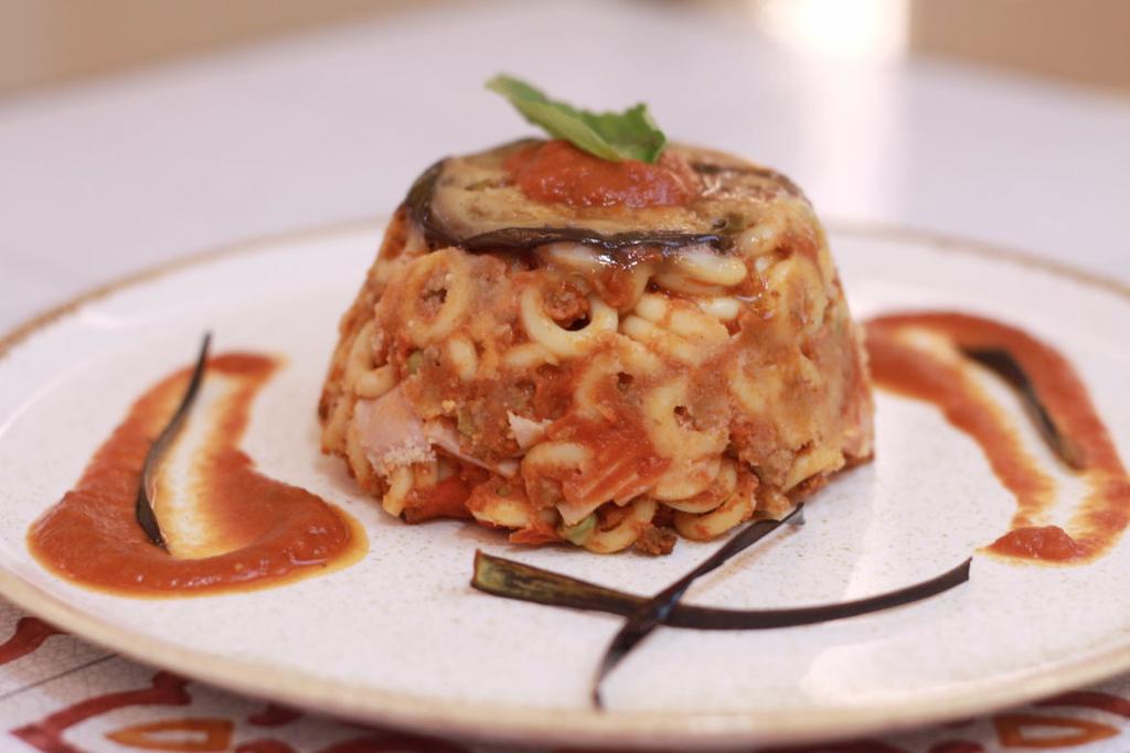 STEP 2: First course SICILIAN TIMBALLO Sicilian cuisine is rich in dishes known and loved all over the world. Among these there are certainly the baked ANELLETTI.