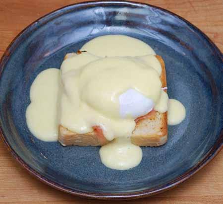 16 10 Finally, drape the egg, salmon, and toast with a generous helping of hollandaise sauce. Optional: You can garnish this with chopped fresh parsley before serving.