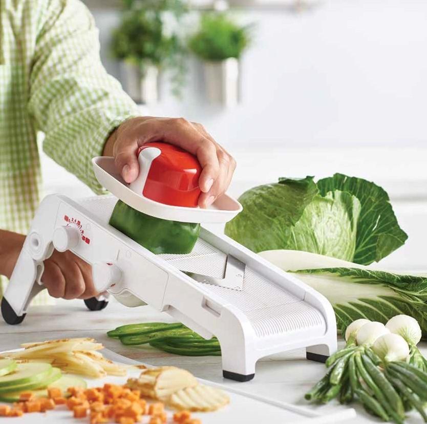 Food guider features molded teeth and metal pins for secure food
