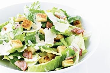 Caesar Salad Salad ½ head Romaine lettuce 1 clove garlic 1 small egg 5 ml Worcestershire sauce 15 ml lemon juice 125 ml oil 4 slices bacon, cooked/ crumbled 50 ml Parmesan cheese, grated Crouton : 1