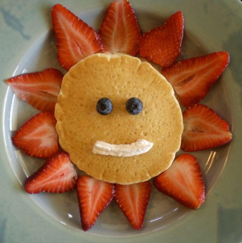 The Sun This is as easy and as delicious as pancake pictures get. It calls for slices of strawberry around a basic round pancake, blueberry eyes, and a whipped-cream smile.