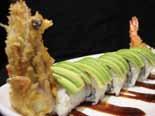 sushi rice topped with raw fish, tamago, ikura, ebi and