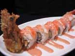 Tiger Roll tempura tiger prawn topped with sliced cooked
