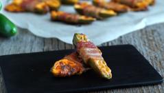 Bacon-Wrapped Jalapeño Yields: 12 poppers Ingredients 6 fresh jalapeño peppers 250 grams (about 1 cup) cream cheese, softened 1 cup shredded old cheddar cheese 1 clove garlic, minced 1/2 teaspoon