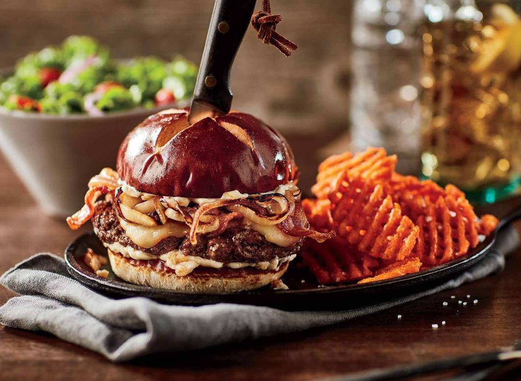 Steakhouse Our take on a must-have premium burger for your menu. A ground sirloin patty topped with roasted garlic mayonnaise, caramelised onions, cheese and bacon all packed in a pretzel bun.