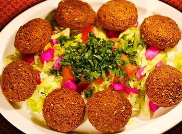 tossed in our homemade Lebanese dressing. ADD CHICKEN SHAWARMA $3 VEGGIE FALAFEL PLATE (8pc) 7.99 Served with Tahini sauce & pita.