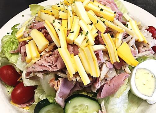 SALADS CHEF'S SALAD 7.99 Oven roasted turkey, Dearborn ham, lettuce, tomatoes, cucumbers, red onions, hard boiled egg, Swiss and American cheese served with pita. HAM or TURKEY SALAD 7.