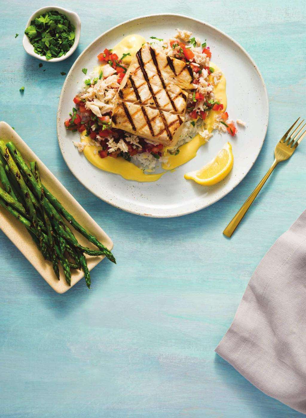 99 NEW SEARED OR GRILLED HALIBUT * Served with lump crab pico de gallo, our rich lemon butter sauce, cilantro jasmine rice, and seasonal vegetables. / 25.