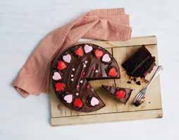 Finished with chocolate topping and red and pink sugar hearts. Every cake has been lovingly handmade and decorated by our dedicated team of bakers, using the finest ingredients.