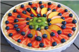 (c) 11 The picture below shows a pastry based fruit tart made using batch production.