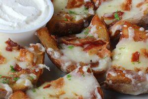 99 Potato Skins Crispy skins topped with a melted cheddar cheese and bacon pieces,