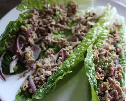 Thai inspired pork & lettuce wraps 5ml extra virgin olive oil 400g 10% fat pork mince 4 spring onions, finely chopped 1 small red onion, sliced 4 tsps fish sauce (nam pla) 2 tsps red chilli flakes
