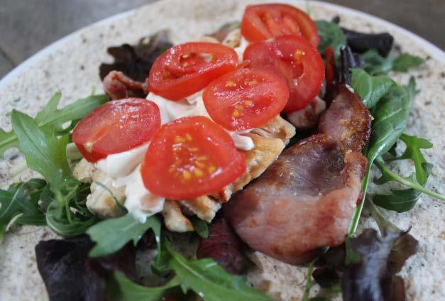 Chicken & bacon salad wrap 1 tsp ghee or coconut oil 120g chicken breast, diced 2 rashers back bacon handful of salad leaves 2 small vine tomatoes, sliced 1 seeded wrap (use