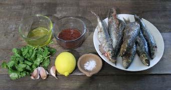 Mix the harissa paste, olive oil, garlic and lemon juice in a bowl. Spoon the mixture over the sardines, covering both sides of the fish.