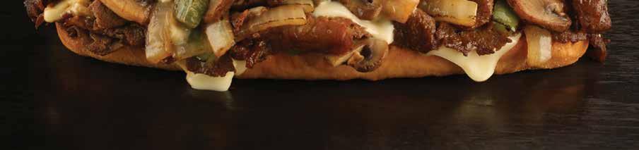 THE PHILLY CHEESESTEAK Shaved steak on a warm hoagie roll topped with cheese and served with french fries.