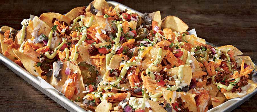 CANTINA NACHOS shareables & snackables CANTINA NACHOS YOUR CHOICE OF BUFFALO CHICKEN OR GREEN CHILE STEAK With spicy chorizo sausage, jalapeño white queso, shredded cheeses, house-made black beans,
