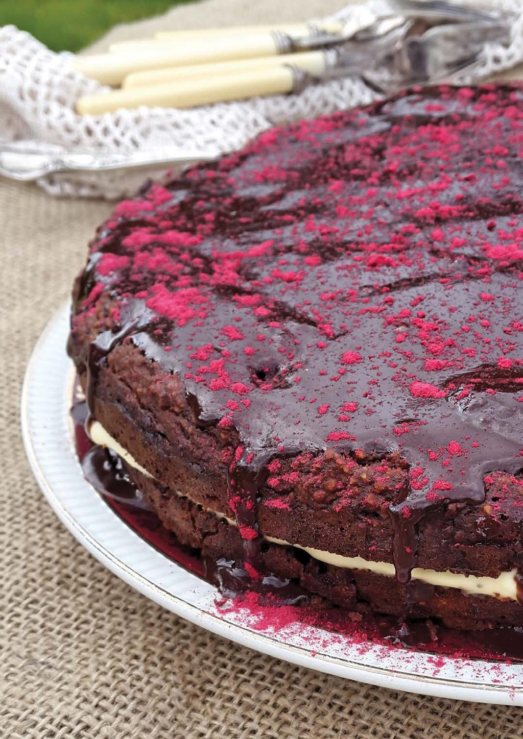 RASPBERRY Chocolate & SERVES 12 Cake 1½ cups pitted dried dates, soaked in recently boiled water for 10 minutes and then drained and squeezed thoroughly ¼ cup coconut oil, melted 1 heaped tsp baking
