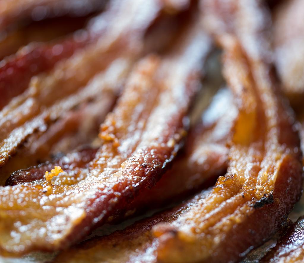 Baconis 8. Cut bacon into small cubes. Sauté on a hot skillet add butter to crisp the bacon. Place the fried bacon onto a plate with a paper towel so that the fat drains off.