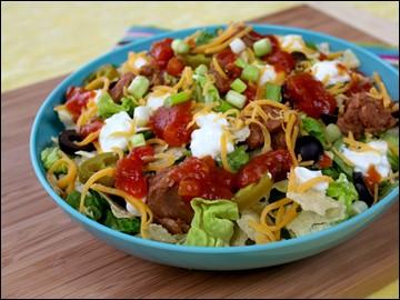 Nacho-Mexi-Salad PER SERVING (entire recipe) 274 calories, 3.75g fat, 1084mg sodium, 47g carbs, 10.5g fiber, 7g sugars, 41.