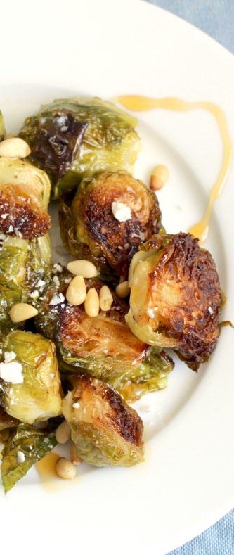 SIDES Crispy Cheesy Brussels Sprouts 1 lb. large Brussels sprouts, halved 2 tbsp olive oil ½ tsp black pepper 1 oz. blue cheese or feta cheese 1 tbsp organic honey 1. Preheat oven to 400 degrees. 2. Toss the Brussels sprouts with olive oil on a large, rimmed, sheet pan.