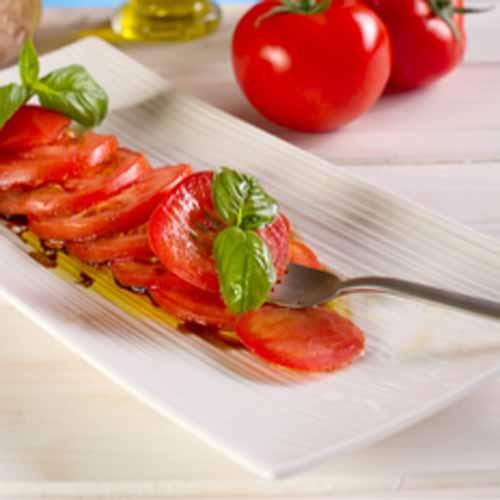 Wednesday, 13th June 2018 Tomato Basil Salad (DF) 1 1/2 medium heirloom tomatoes, (or whatever is seasonal near you) 1/2 handful fresh garden fresh basil 1 1/2 tablespoons extra virgin olive oil