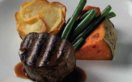 MAIN Juicy eye fillet steak or tender chicken breast with a full-bodied jus dressed with lashing of plum sauce accompanied by roast pumpkin, green