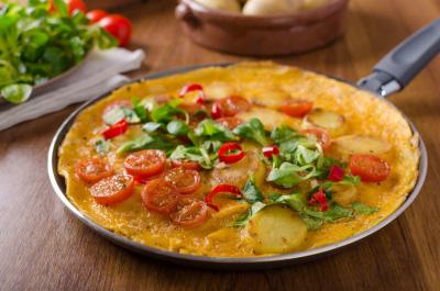 Cancun Frittata Serves: 4 2 Red Chillies, sliced 300g Russet Potatoes, thickly sliced 2 tbsp Olive Oil 1 medium Onion, finely chopped 1 tbsp Chilli Puree 3 Garlic Cloves, minced small handful of