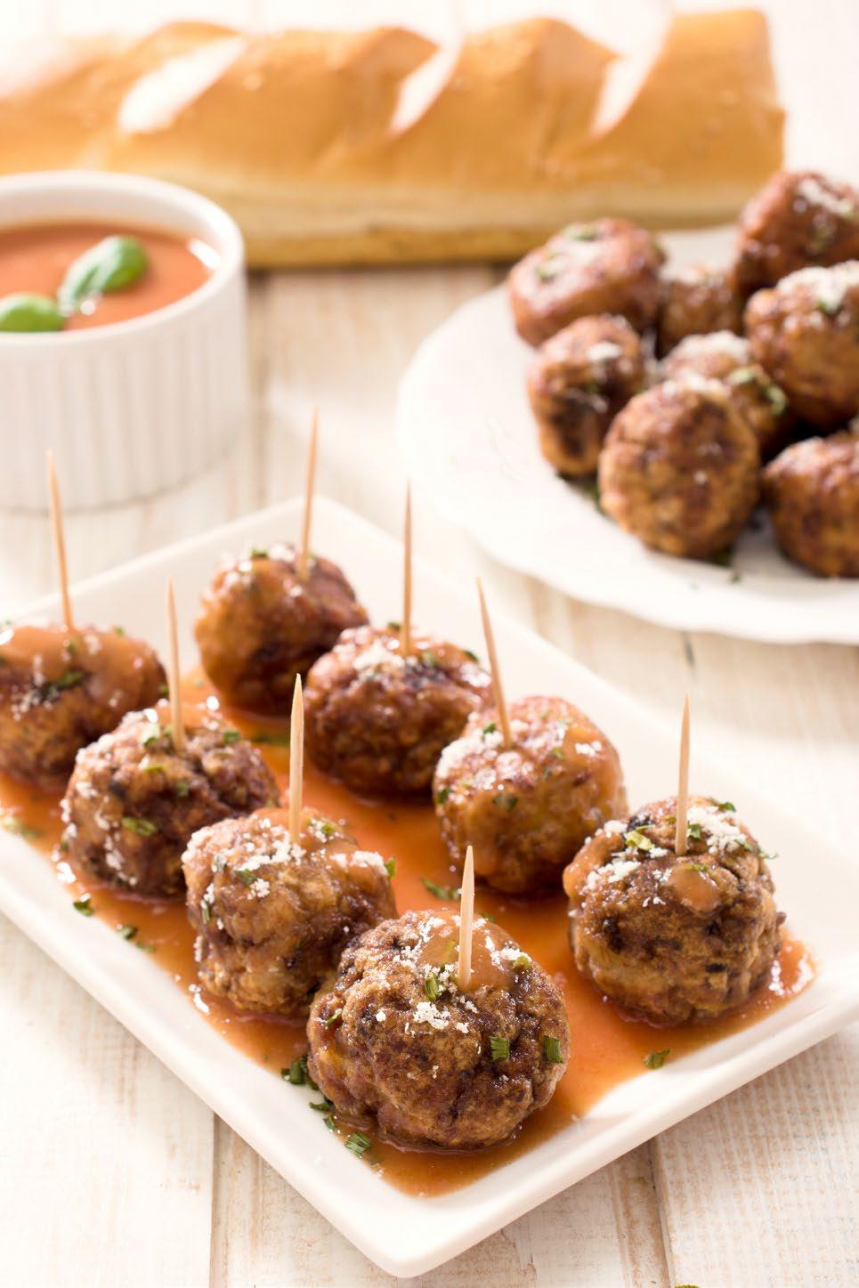 With wet hands, prepare 24 meatballs with the chicken mixture. Heat 1 tablespoon of oil in a large skillet over medium heat.