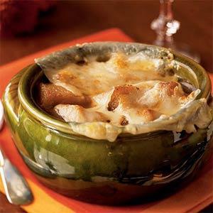 Onion Soup Gratinée 1/4 cup butter 3 onions, thinly sliced 1 teaspoon white sugar 1 tablespoon flour 1/4 cup sherry 3 cups beef broth 3 cups chicken broth 1 French baguette 8 ounces sliced Swiss
