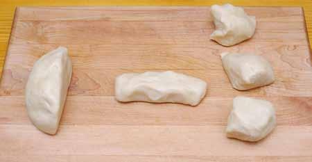 12 8 Divide the dough by first cutting it into 1/3 and 2/3 sections. (The 1/3 section is to the left.