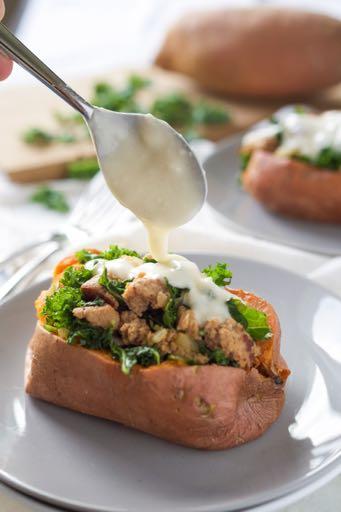 Kale and Sausage Stuffed Sweet Potatoes ChickenandPoultry 6 medium sweet potatoes, rubbed with oil 1¼ pounds Sweet Italian Turkey sausage, casing removed 1 small sweet onion, minced 4 cups finely