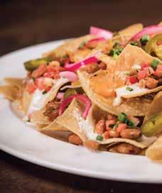 (691 cal) CLASSIC NACHOS Crispy tortilla chips piled high and layered with ranch-style beans, a four-cheese sauce blend, then topped with fresh pico de gallo, spicy jalapeños, pickled onions, and