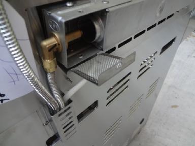 9. 10. 11. Remove the left screw of the rotisserie burner bracket that mounts the burner to the back of the unit. 12.