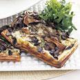Wild Mushroom and Gruyère Tart with Apple slices and Seedless Grapes Yield: Makes 6 to 8 appetizer servings The base of the tart is purchased puff pastry, which makes this dish as easy as it is