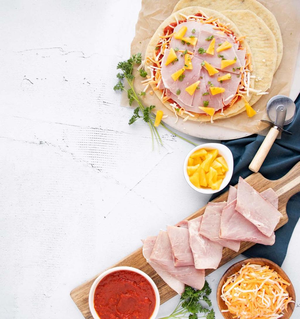 Modena Ham and Pineapple Pizza FEATURE RECIPE SERVES 2 1 thin crust pizza shell, whole wheat or plain cup Sunterra pizza sauce 1/2 cup mozzarella and cheddar cheese, shredded 80g Modena ham, thinly