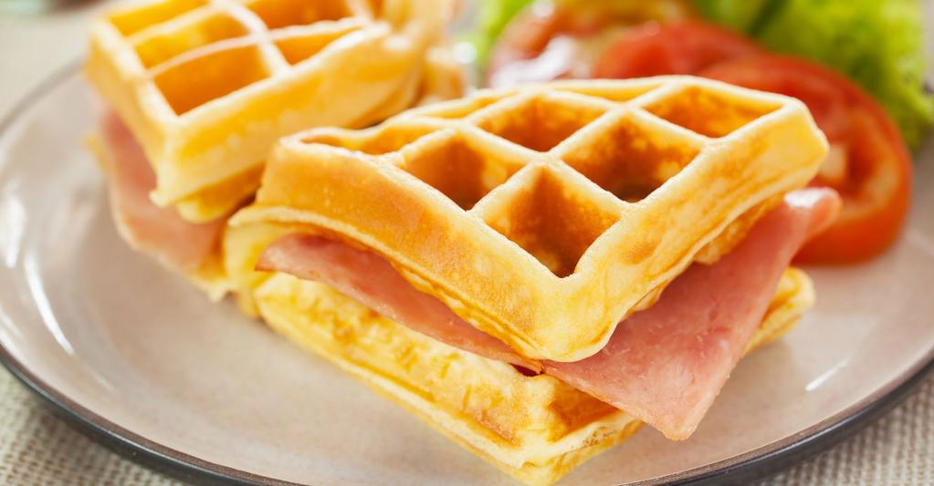 On one of the lightly toasted waffles, drizzle honey mustard, then later honey ham, and provolone cheese. 2.