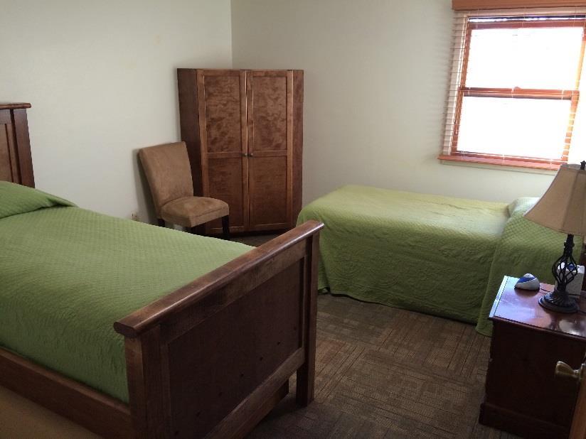 Each room has two twin beds and bathroom.