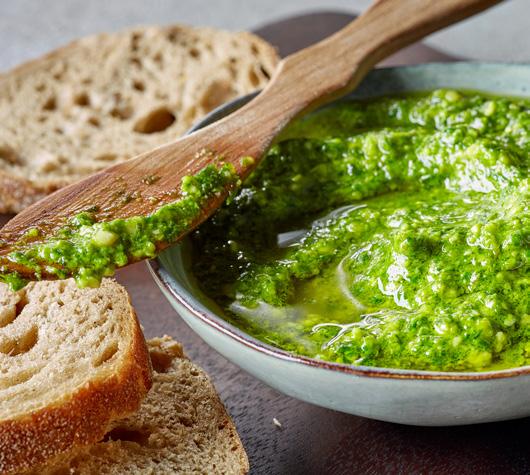 PARSLEY PESTO SAUCE 14 2 cloves garlic 2 cups packed, stemmed Italian parsley Course salt 1/4 cup walnuts 1/2 cup freshly grated Parmesan cheese, or to taste 2/3 cup olive oil Salt and pepper In a