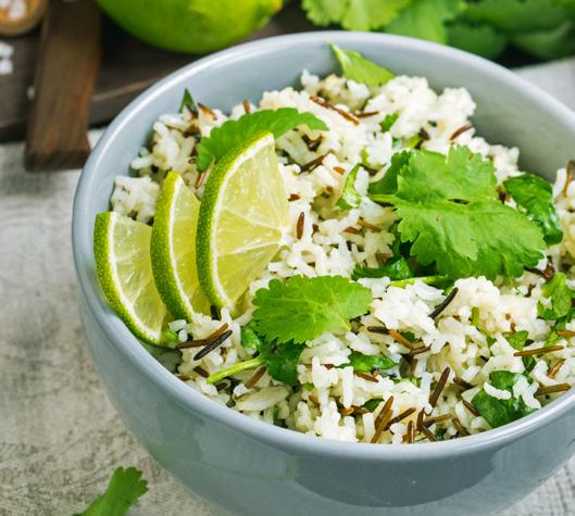 CILANTRO BUTTER LIME RICE 18 2 cups water 1 tablespoon butter 1 cup long-grain white rice 1 teaspoon lime zest 2 tablespoons fresh lime juice 1/2 cup chopped cilantro Bring the water to a boil; stir