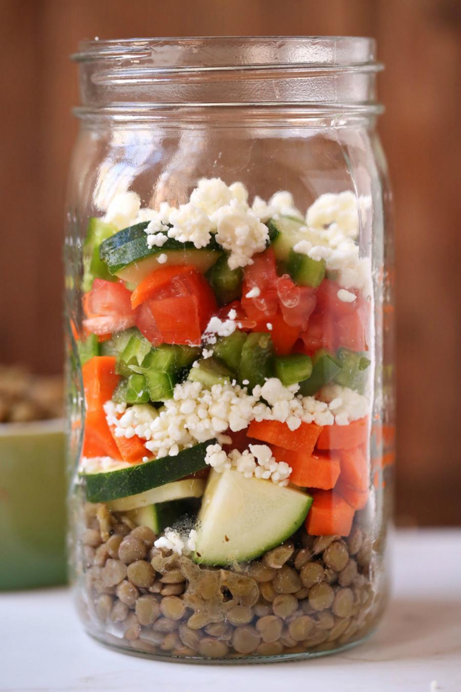 MASON JAR LENTIL SALAD 1 cup of lentils, cooked & drained ⅓ cup zucchini ⅓ cup of feta cheese ⅓ cup diced tomatoes ⅓ cup of bell pepper ¼ cup of diced carrots 1-2 tbsp.