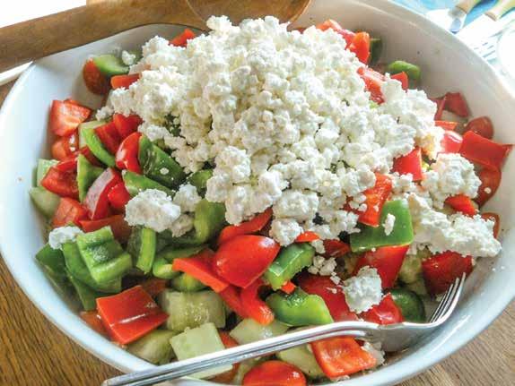In a bowl, gently combine the tomatoes, bell pepper, onion, oil, and vinegar. Season with salt and pepper to taste. 3. Sprinkle the top with the crumbled feta and serve.