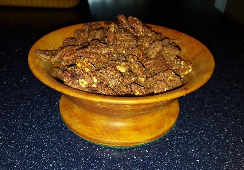 Spicy Pecans Ingredients: Vegetable oil to grease the baking sheets 1 egg white 4 cups (about 1#) Pecan Halves 1/3 cup sugar 1 TBS unsweetened Cocoa Powder 2 tsp Chili Powder 1 tsp Ground Cumin 1/2