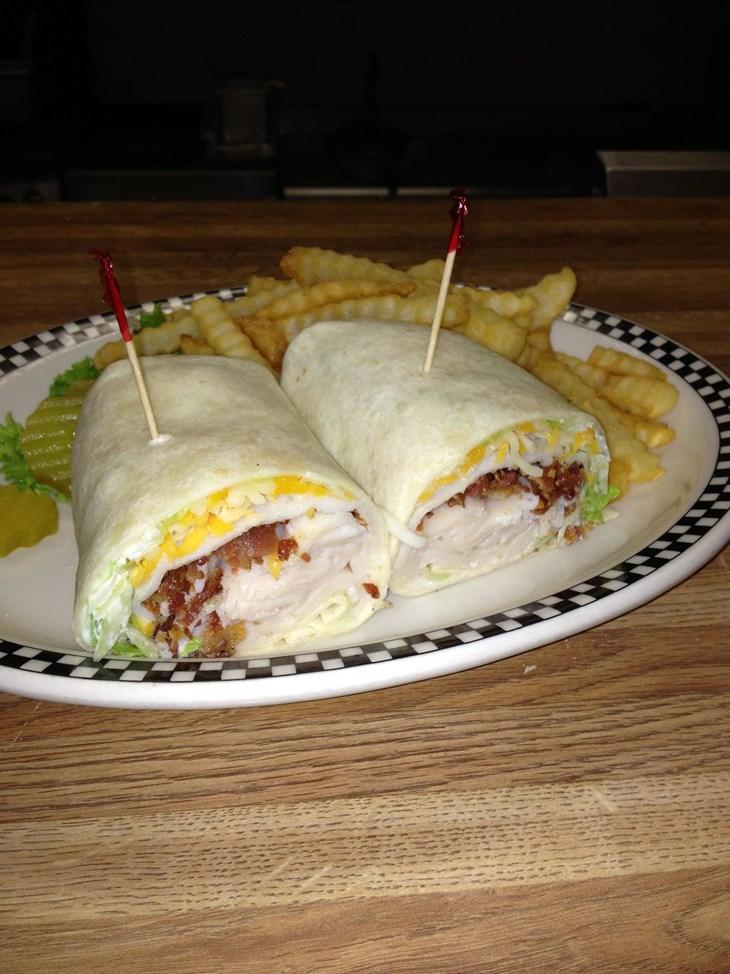 (Pictured) $11.99 with grilled onions, mushrooms, bacon, cheddar cheese Wraps Cajun Chicken $9.99 with cheese, lettuce, and tomatoes Buffalo Chicken $9.