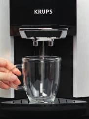 To use a large cup (or mug), you migt ave to remove te small drip tray (6). Press te OK butto. Coosig te volume. Te scree displays te last volume requested.