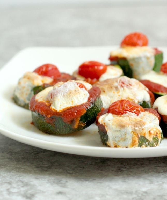 SIDES Zucchini Pizza Bites 1 large zucchini cut into ¾-inch rounds 1 tbsp olive oil ½ tsp ground sea salt ½ cup spaghetti sauce 8 cherry tomatoes ¼ cup mozzarella 1. Preheat grill to medium-high heat.