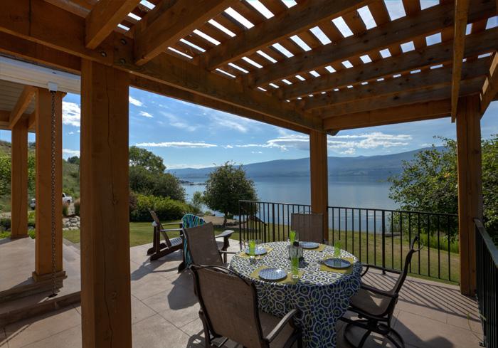 This incredible lake front property features large spacious gardens, multiple patios overlooking Lake Okanagan, a hot tub, BBQ, a fully