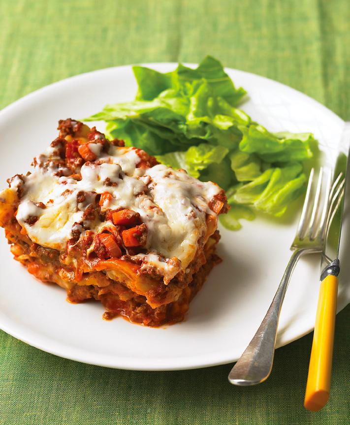 SLOW COOKER SAUSAGE LASAGNA This meat sauce starts quickly on the stove, but hours in the slow cooker adds depth.
