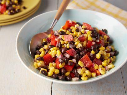 Corn and Bean Salad 1 can, 14 ounces, black beans, rinsed and drained 2 cups frozen corn kernels 1 small red bell pepper, seeded and chopped 1/2 red onion, chopped 1 1/2 teaspoons ground cumin, half
